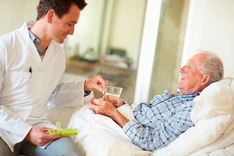 a doctor gives a pill for prostatitis